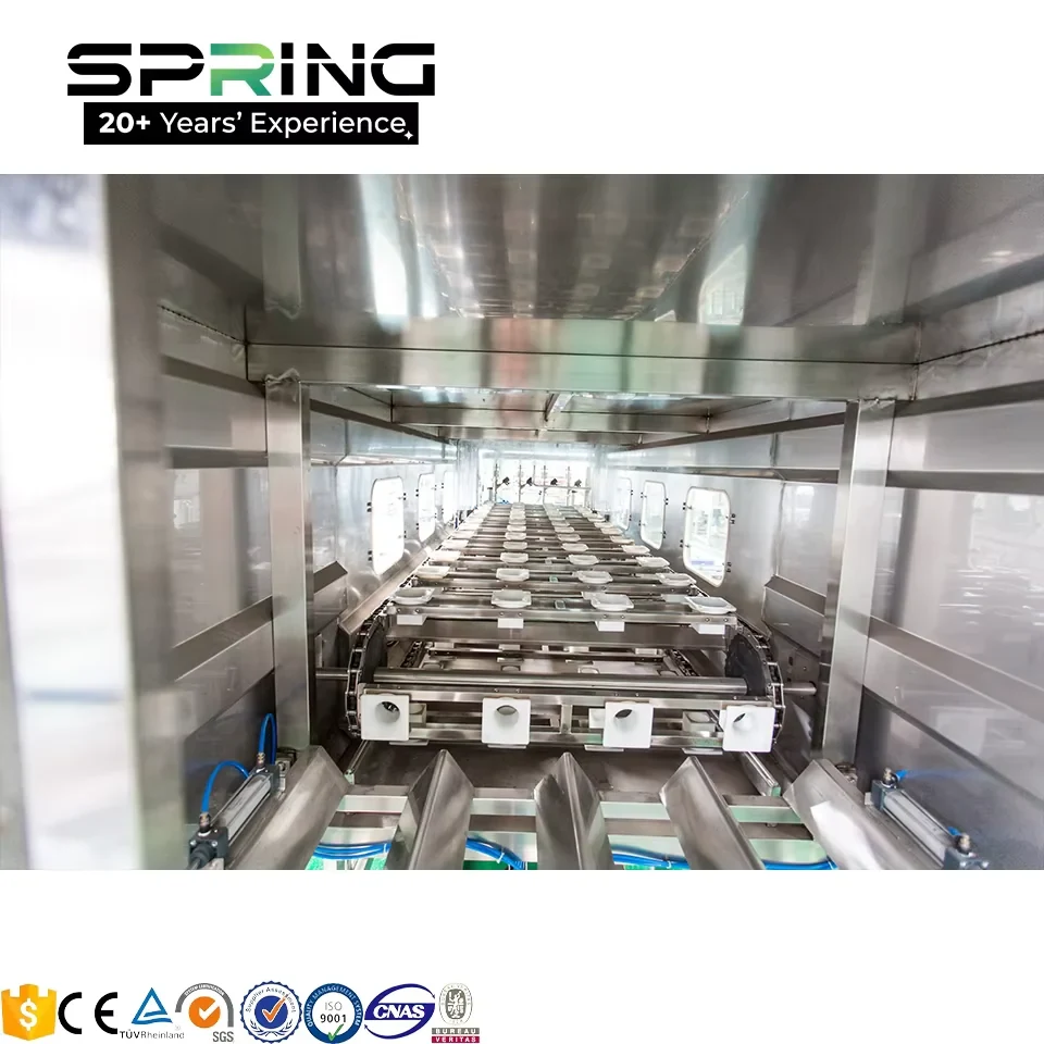 Returnable 5 gallon water bottles moving through barrel filling line 缩略图